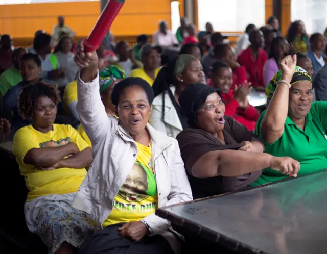 ANC supporters cheer as they watch proceedings of no-confidence vote