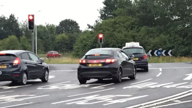 Cars at roundabout