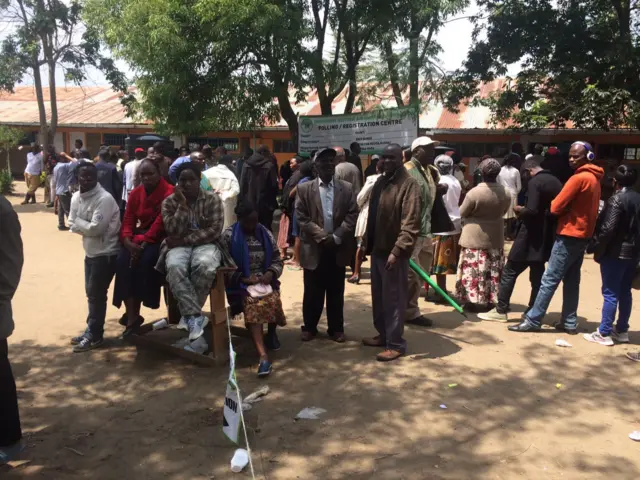 People wait in line
