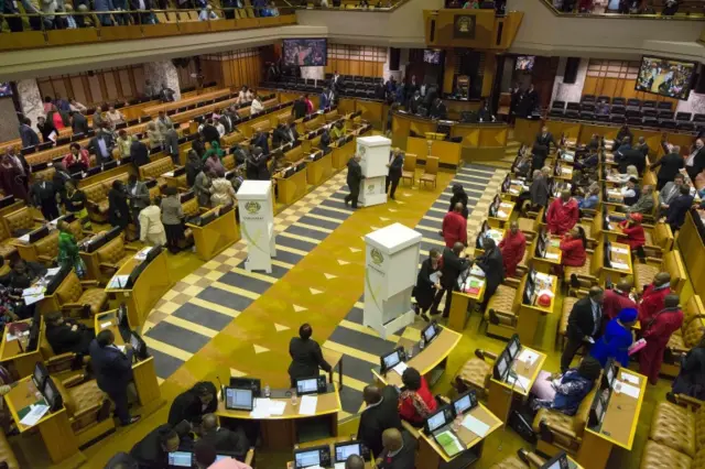 Voting booths are brought into the South African parliament to allow Members of Parliament to vote for or against the motion of no-confidence against South African president, Jacob Zuma (not pictured) in the South frican parliament, on August 8, 2017, in Cape Town