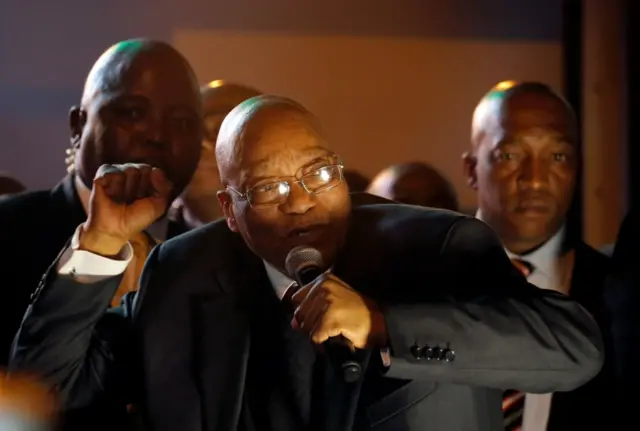 President Jacob Zuma celebrates with his supporters after he survived a no-confidence motion in parliament vote in Cape Town, South Africa, August 8, 2017