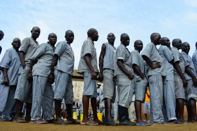 Prisoners wait in line to vote in Kisumu, on Lake Victoria.