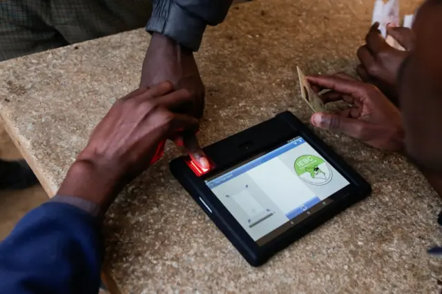 Voters using electric ID system