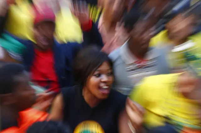 Protesters from the ruling party African National Congress (ANC) dance and sing in support of South African president Jacob Zuma outside parliament in Cape Town, South Africa, 08 August 2017.