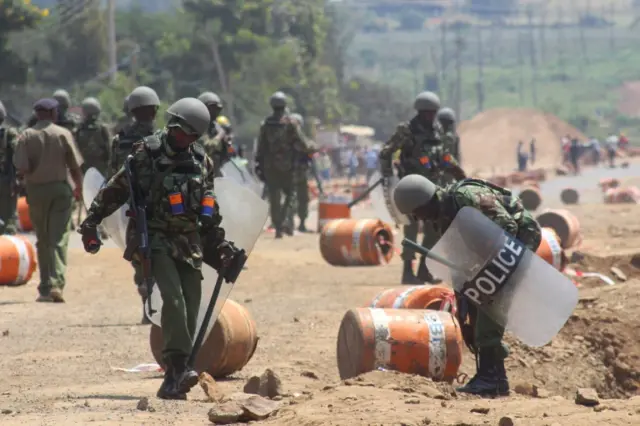 Riot policemen deploy after demonstrators supporting opposition leader Raila Odinga, burned tyres after their political leader claimed "massive" fraud in this week"s elections, in Kisumu, Kenya August 9, 201