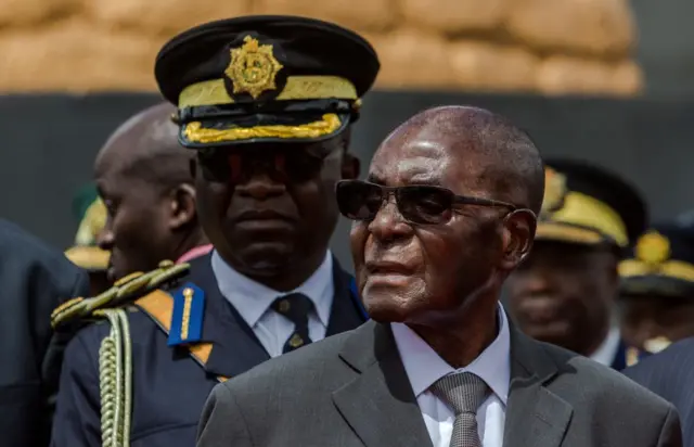 Zimbabwe's President Robert Mugabe attends the burial of Brigadier General James Murozvi, who was granted national hero status by President Robert Mugabe, at the National Heroes Acre in Harare, on April 12, 2017