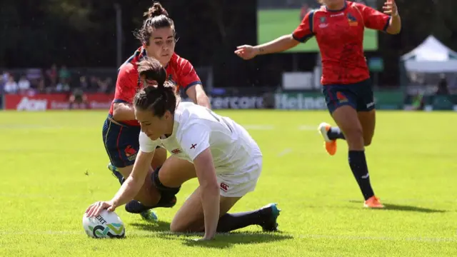 Emily Scarratt of England scores during the game