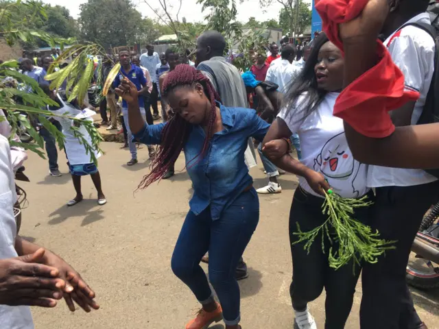 Woman celebrates on the street