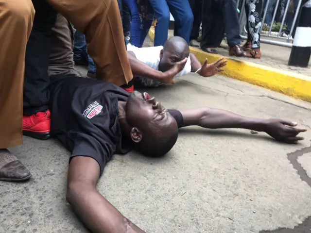 Kenyan man on floor