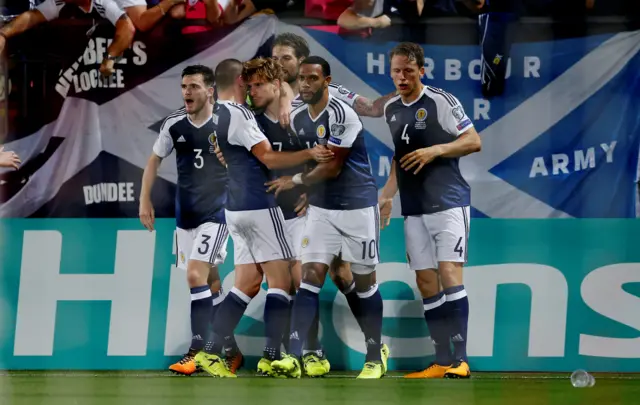 Stuart Armstrong is congratulated after heading Scotland in front