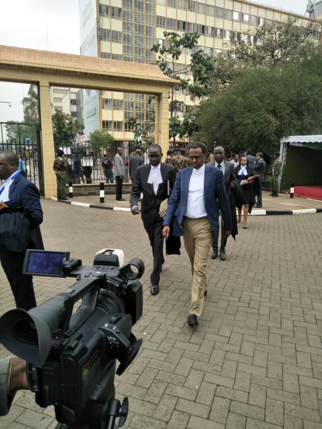 Men walking into a building