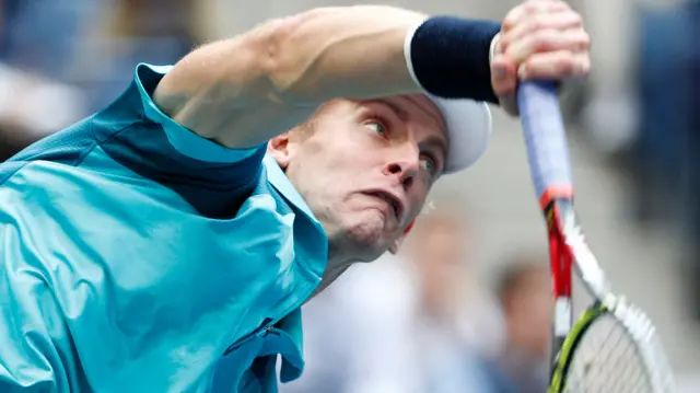 Kevin Anderson of South Africa serves