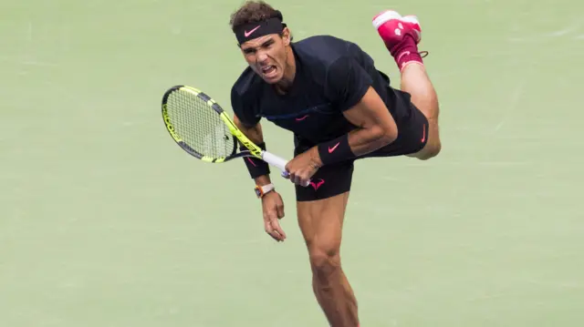 Rafael Nadal of Spain serves