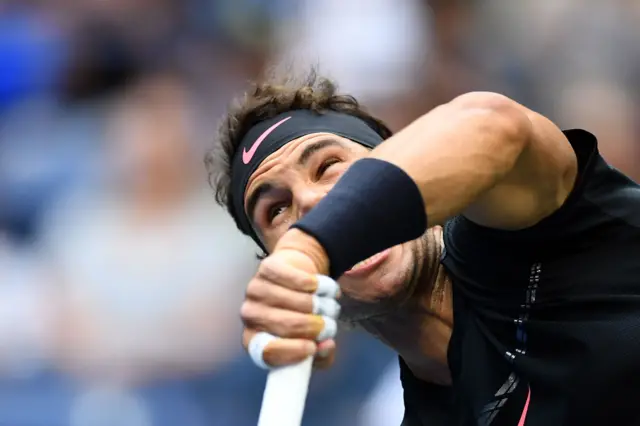 Rafael Nadal serves