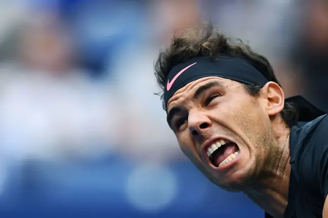 Rafael Nadal serves