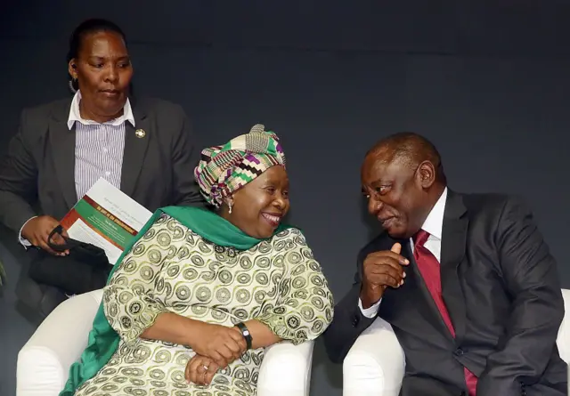 Nkosazana Dlamini Zuma (L) chats with South African Deputy President Cyril Ramaphosa