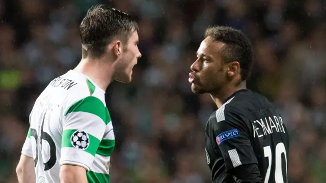 Celtic's Anthony Ralston is blown a kiss by PSG's Neymar