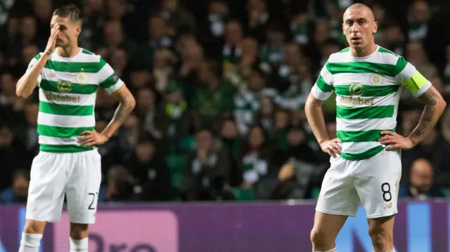 Celtic's Mikael Lustig and Scott Brown are left despondent