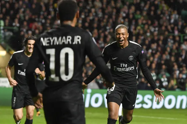 PSG's Kylian Mbappe (right) thanks Neymar for his pass