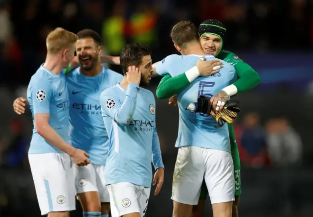 Manchester City players celebrate at full time