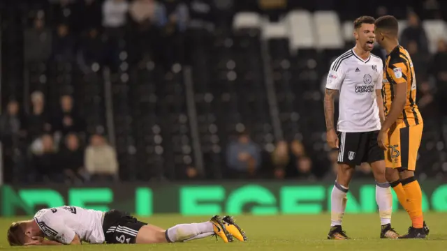 Ryan Fredericks of Fulham confronts Fraizer Campbell of Hull City after he fouled Tomas Kalas