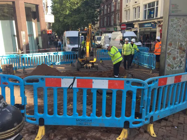 Engineers at the site of a fire in Birmingham city centre