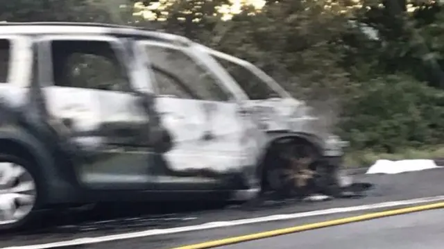 Burnt out car on the M40