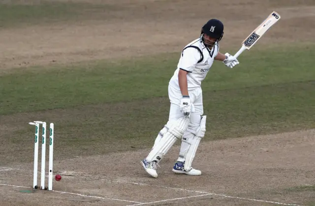 Jonathan Trott of Warwickshire is bowled by Sam Cook