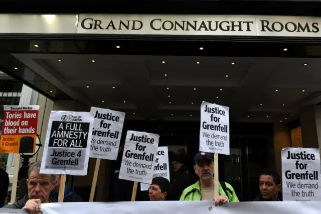 Placards outside Connaught Rooms