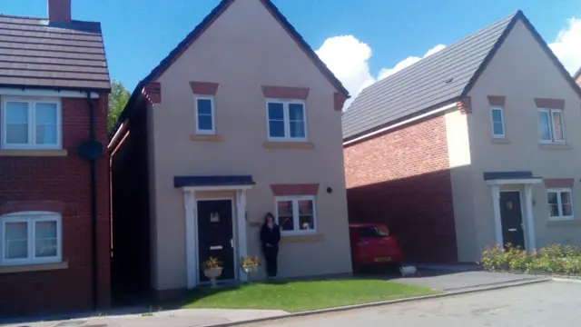 Anna Holt outside her house in Measham