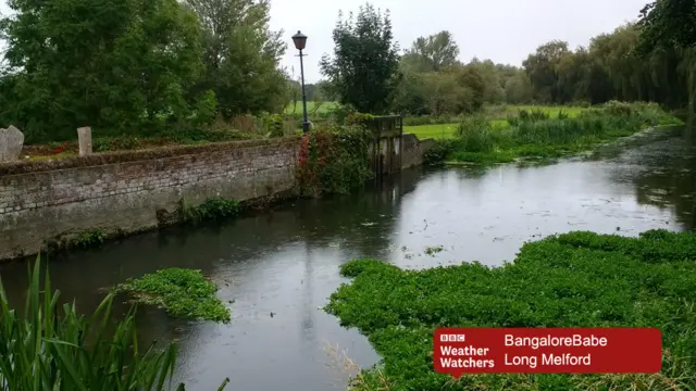 Rain drops on river