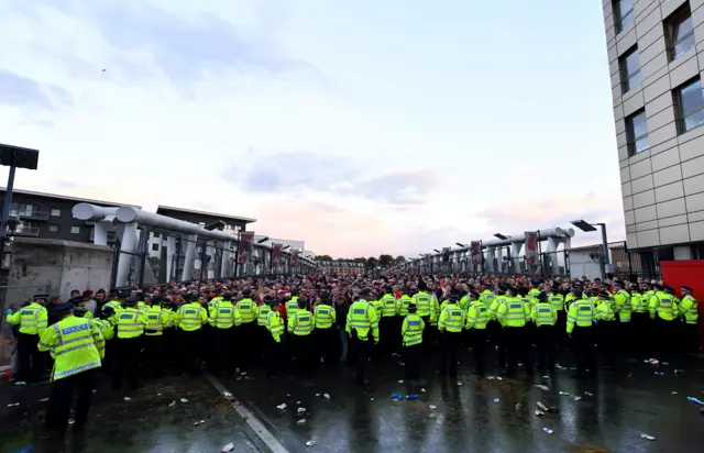 fans are held by police