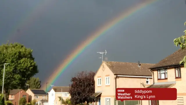 Rainbow over houses