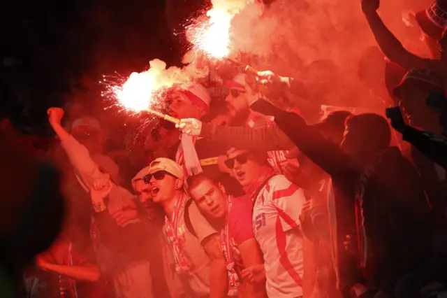 Cologne fans light flares