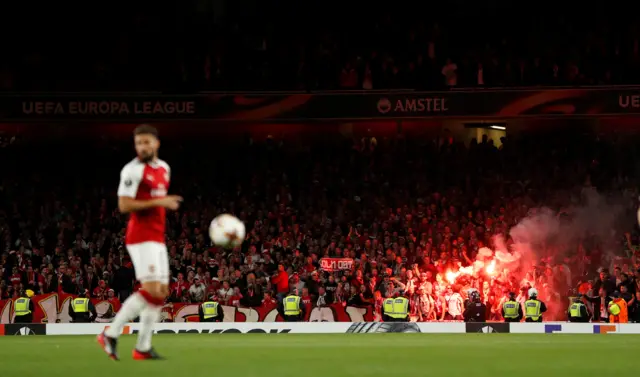 Koln fans let off a flare