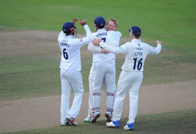 Simon Harmer celebrates with team mates after taking the winning wicket