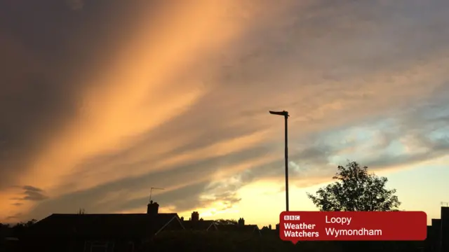 Early morning cloud over houses