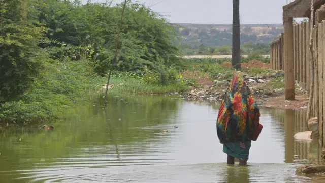 Woman in flood water