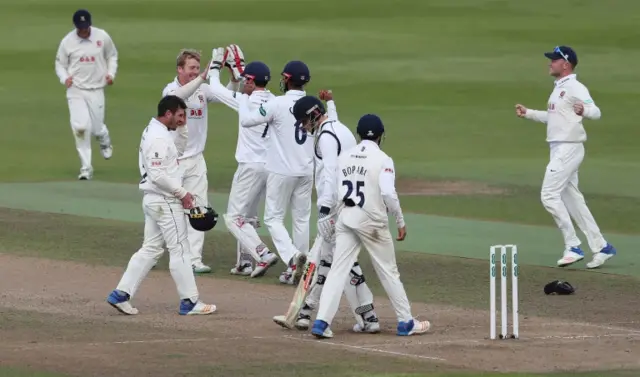 Essex cricket team celebrating after taking final Warwickshire wicket