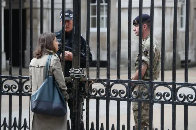 Armed police and soldier at Whitehall