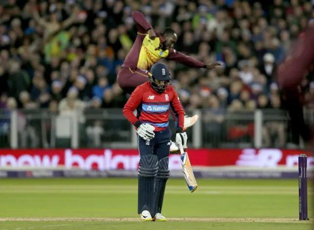 West Indies Kesrick Williams celebrates after taking the wicket of England's Adil Rashid