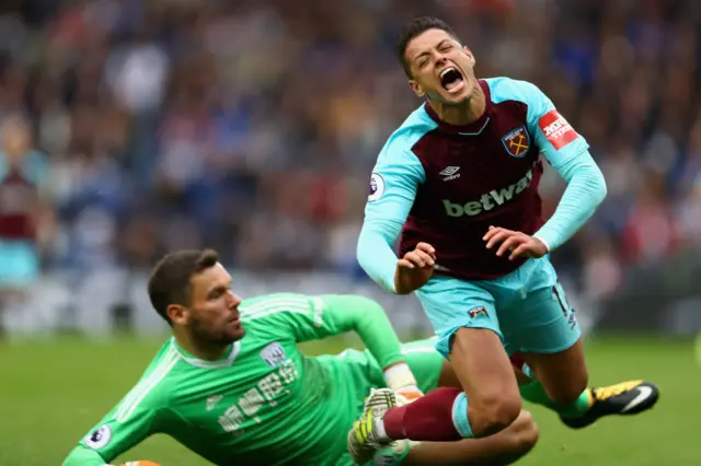 Ben Foster tackles Javier Hernandez