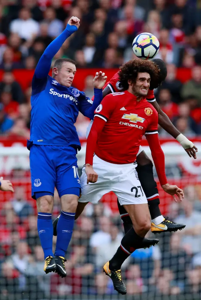 Wayne Rooney and Marouane Fellaini