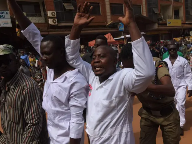 Man being arrested in Kampala