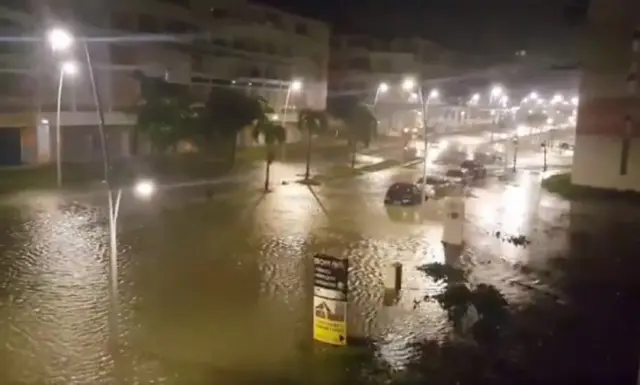 A flooded street in Pointe-a-Pitre after the powerful winds and rain of hurricane Maria battered the French overseas Caribbean island of Guadeloupe