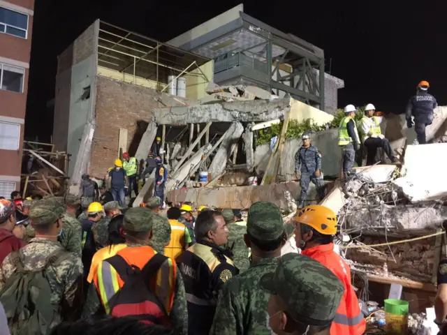 Rescue team work at the collapsed Enrique Rebsamen school in Mexico City early on 20 September 2017