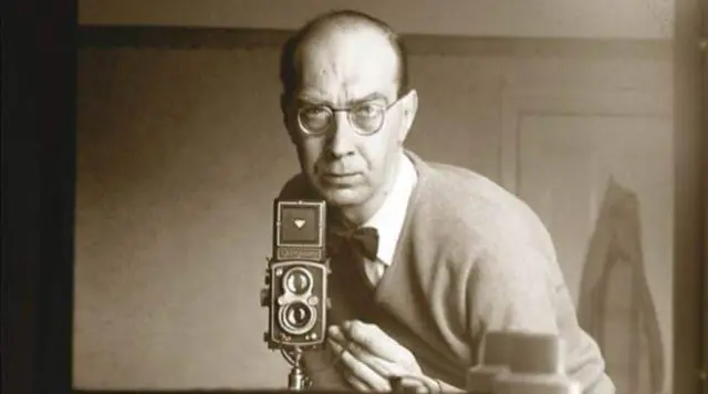 Philip Larkin taking a picture in a mirror.