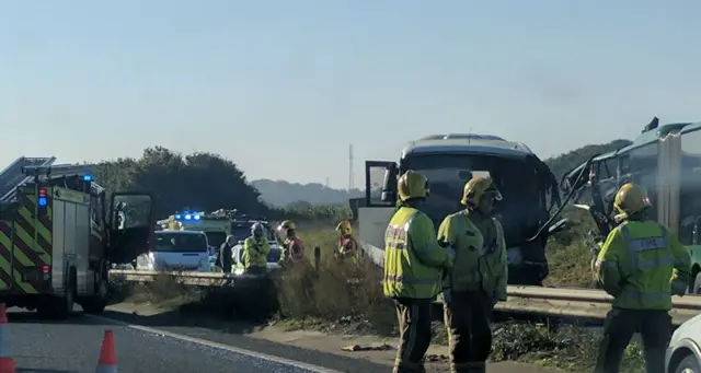 Emergency services beside crash vehicles