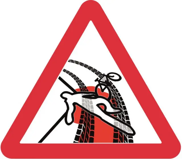 A triangular warning sign showing a figure on the floor with a bike and tire marks.