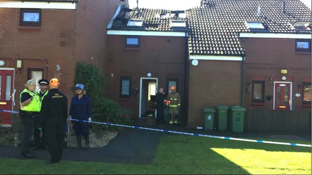 Fire and Rescue officers outside flats in Grimsby.